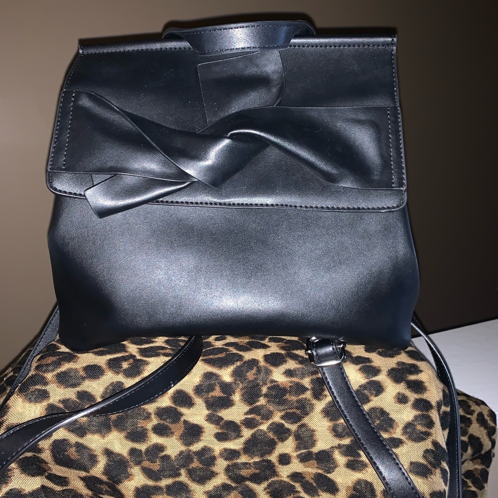 Black leather backpack purse with bow detail